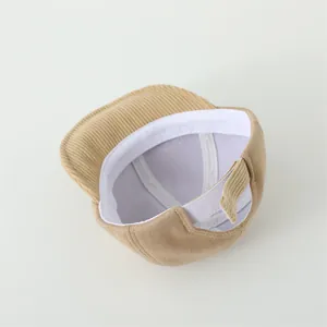 Detail of adjustable strap and sweatband inside the khaki corduroy baby baseball cap