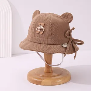 Cute dark camel corduroy bucket hat for babies with bear ears and chin straps