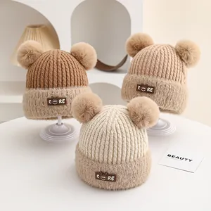 Winter baby knit beanie with dual faux fur pom-poms and warm thickened ribbed texture