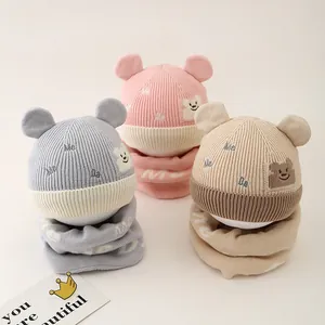 Knitted baby winter hat and scarf set with cute bear design in pink, grey and beige