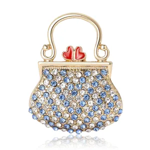 Broche sac à main de luxe ornée de strass bleus et base dorée pour vêtements femme