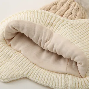 Knit kids' winter hat with warm fleece lining and faux fur pom-pom detail