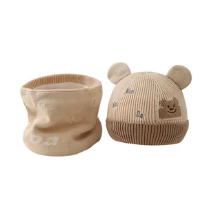 Knit winter baby hat and scarf set with cute bear ears and fleece lining in beige