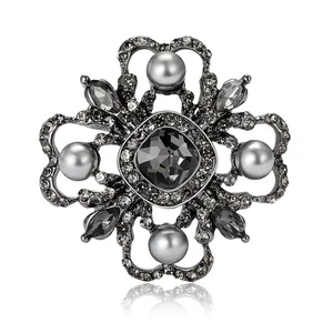 Vintage baroque crystal flower brooch with grey pearls on gunmetal alloy base