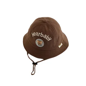 Cute brown baby sun hat with teddy bear embroidery and adjustable windproof strap