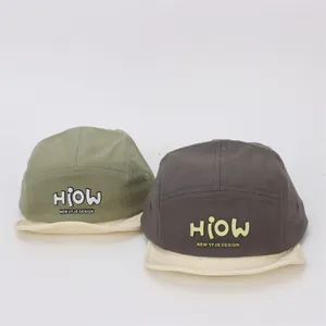 Detail of color-block soft brim baby baseball caps with HIOW lettering design