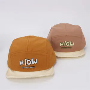 Cute cotton baby baseball caps in yellow and pink with HIOW print and soft brim
