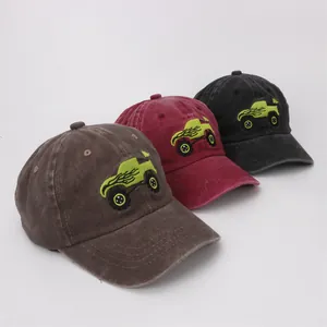 Kids vintage washed baseball caps with embroidered monster truck design in three colors