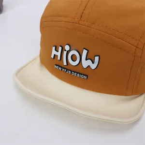 Cute mustard yellow and beige baby baseball cap with HIOW lettering and soft brim
