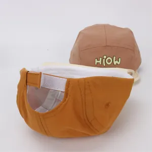 Detail of baby baseball cap featuring adjustable velcro strap and premium inner lining
