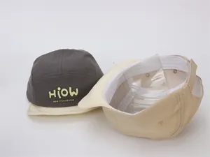 Detail view of baby baseball cap interior showing white sweatband and structural lining