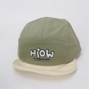 Detail view of cotton baby camper hat with HIOW 3D lettering and flat brim