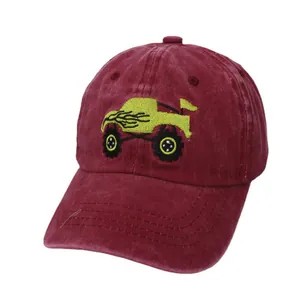 Classic burgundy kids baseball cap featuring an embroidered yellow monster truck design