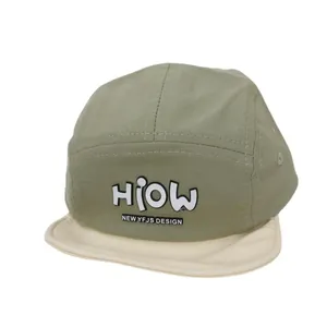 Green and cream 5-panel baby baseball cap with HiOW embroidery and soft brim detail