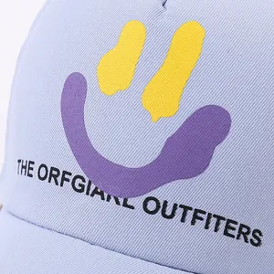Detailed macro view of the lavender cotton twill cap with a yellow smiley face print