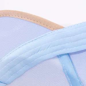 Detail of parallel white stitching and beige trim on light blue kids baseball cap