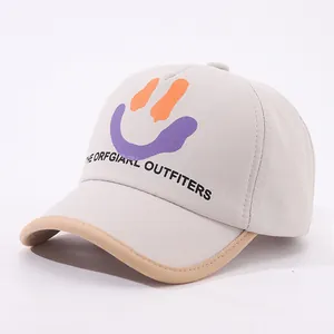 Detail view of cotton canvas kids baseball cap with smiley face print and embroidery