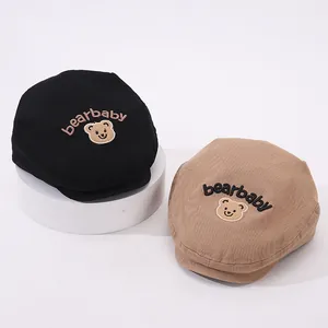 Detailed embroidery of bearbaby text and cartoon bear patch on stylish kids beret hats