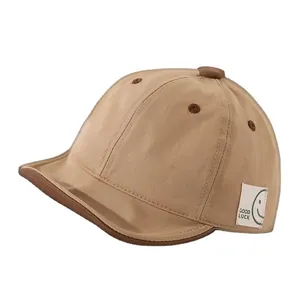 Khaki cotton baby baseball cap with short brim and Good Luck embroidery tag