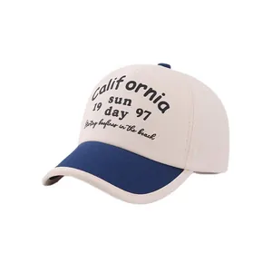Kids baseball cap featuring beige crown and blue brim with California sun embroidery