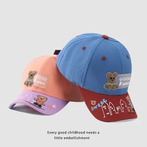 Cute kids baseball cap featuring cartoon bear patches and contrasting vibrant colors