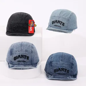 Detail view of four denim camper hats in different washes with GIANTS embroidery