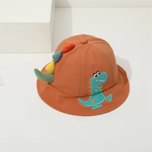 Detail of orange kids fisherman hat with cartoon dinosaur embroidery and 3D back spines