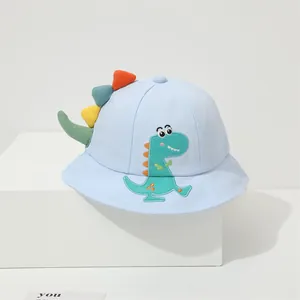 Detail of light blue kids sun hat with cartoon dinosaur embroidery and 3D colorful fins