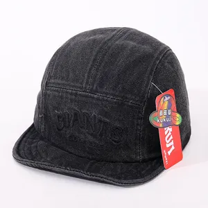 Detail of black denim 5-panel cap featuring GIANTS embroidery and textured fabric