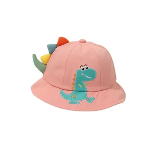 Pink cartoon dinosaur children sun bucket hat with colorful 3D fins on white background