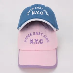 Detailed embroidery of NYC and Upper East Side text on kids cotton baseball caps