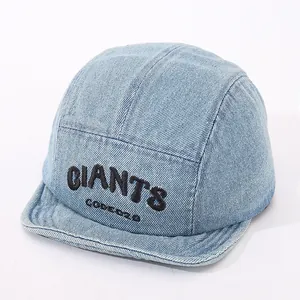 Detail of light blue denim camper hat with black Giants embroidery and soft flat brim