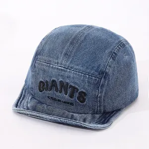 Detailed view of the dark blue denim baseball cap with white GIANTS 3D embroidery
