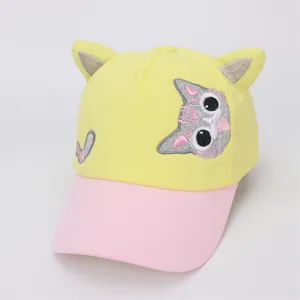 Detail of yellow and pink kids baseball cap with cute cat ear 3D design and embroidery