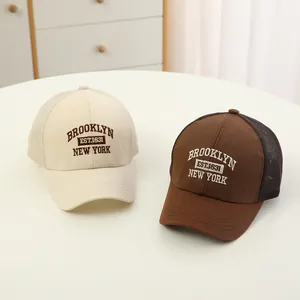 Close-up of retro Brooklyn New York embroidery on breathable mesh kids baseball cap