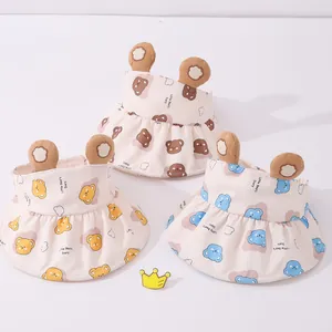 Three children sun visors featuring teddy bear ears and ruffled brims in various colors