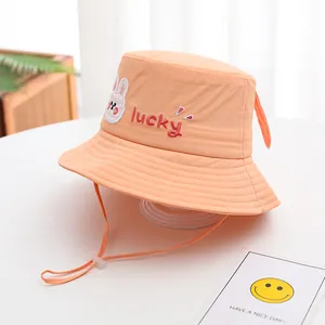 Kids orange bucket hat with rabbit patch and lucky embroidery for sun protection