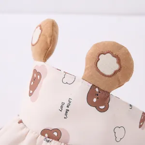 Detail of baby sun hat featuring 3D bear ears and Little Bear embroidery on beige cotton