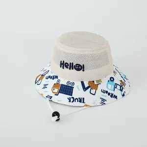 Detail of breathable beige mesh and colorful truck patterns on kids cartoon sun hat