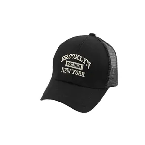 Kids black trucker hat with white Brooklyn and New York embroidery and breathable mesh