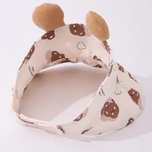 Detail of adjustable velcro closure and cute bear ears on the cream sun visor hat