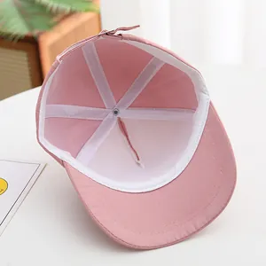 Detailed interior of pink cotton baseball cap with sweatband and adjustable buckle