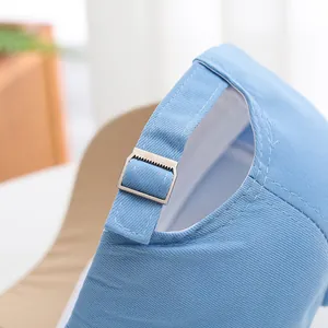 Close-up of light blue cotton baseball cap with adjustable silver metal buckle at back
