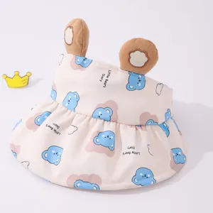 Detail of baby sun visor featuring 3D bear ears and ruffled brim in pink fabric