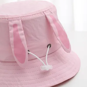 Pink rabbit ear sun hat for kids with adjustable chin strap and wide brim fisherman style