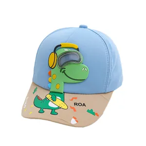 Kids baseball cap featuring a blue and beige color block design and a green 3D dinosaur