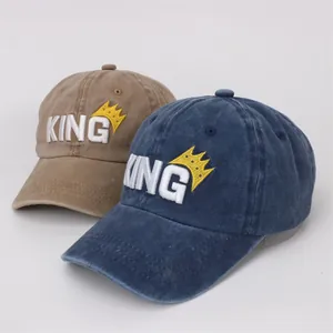 Navy and khaki kids baseball caps with KING embroidery and crown detail in washed cotton