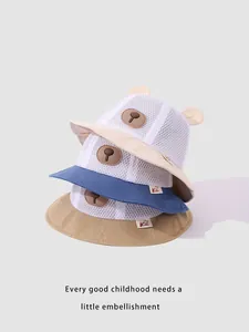 Detailed macro of breathable mesh sun hats with cute bear ears in three soft colors