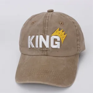 Detailed close-up of khaki cotton baseball cap featuring 3D KING embroidery and yellow crown
