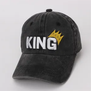 Detail of washed denim kids baseball cap with 3D King embroidery and crown motif